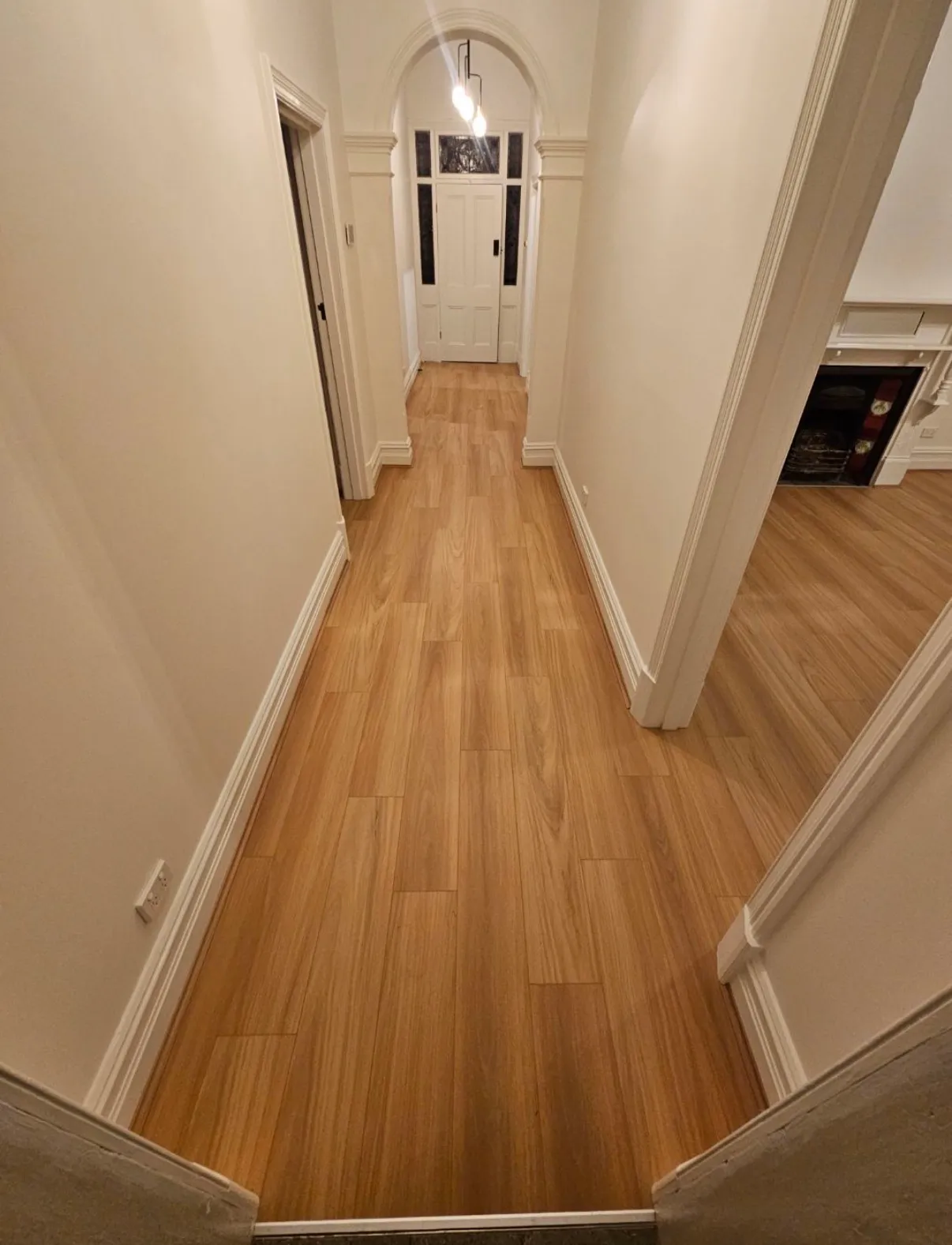 Laminate flooring laid through the hallway of a character home